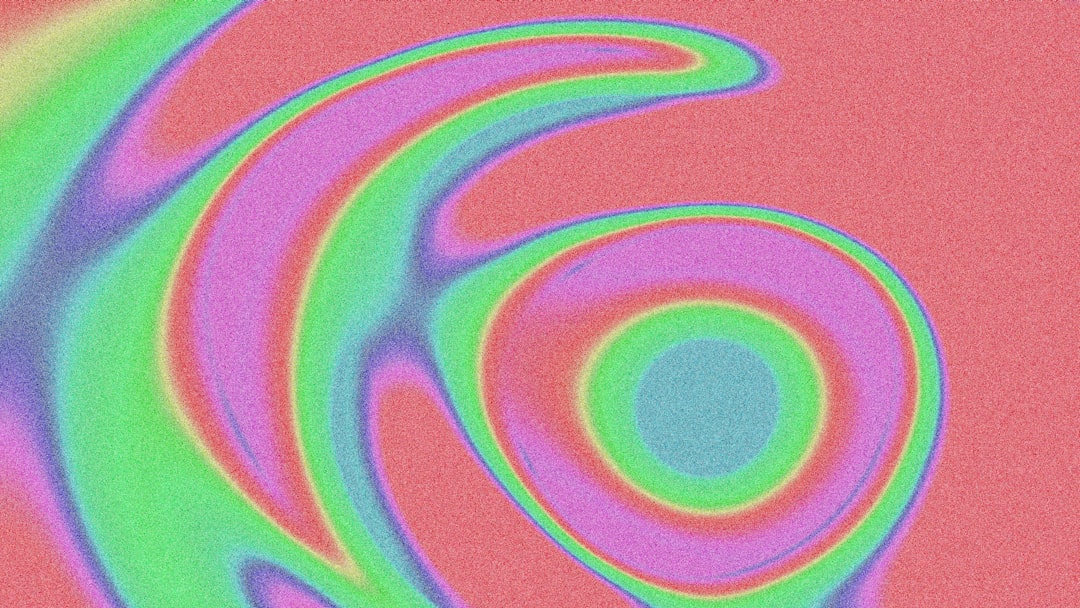 A picture of a spiral design on a pink background