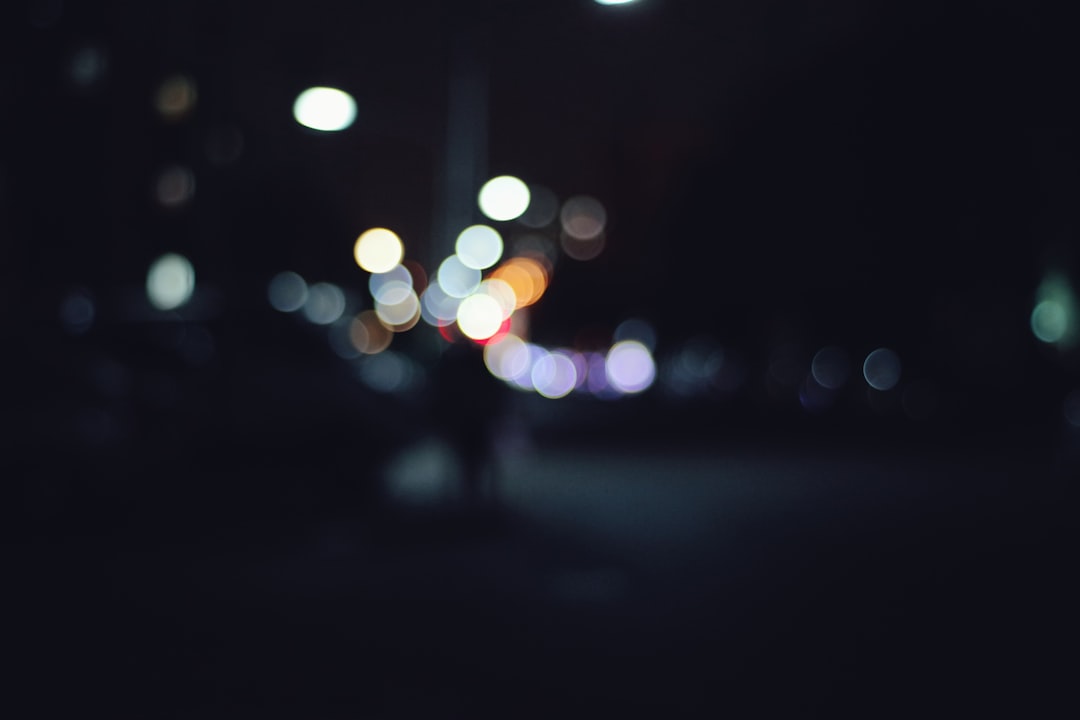 a blurry photo of a city street at night