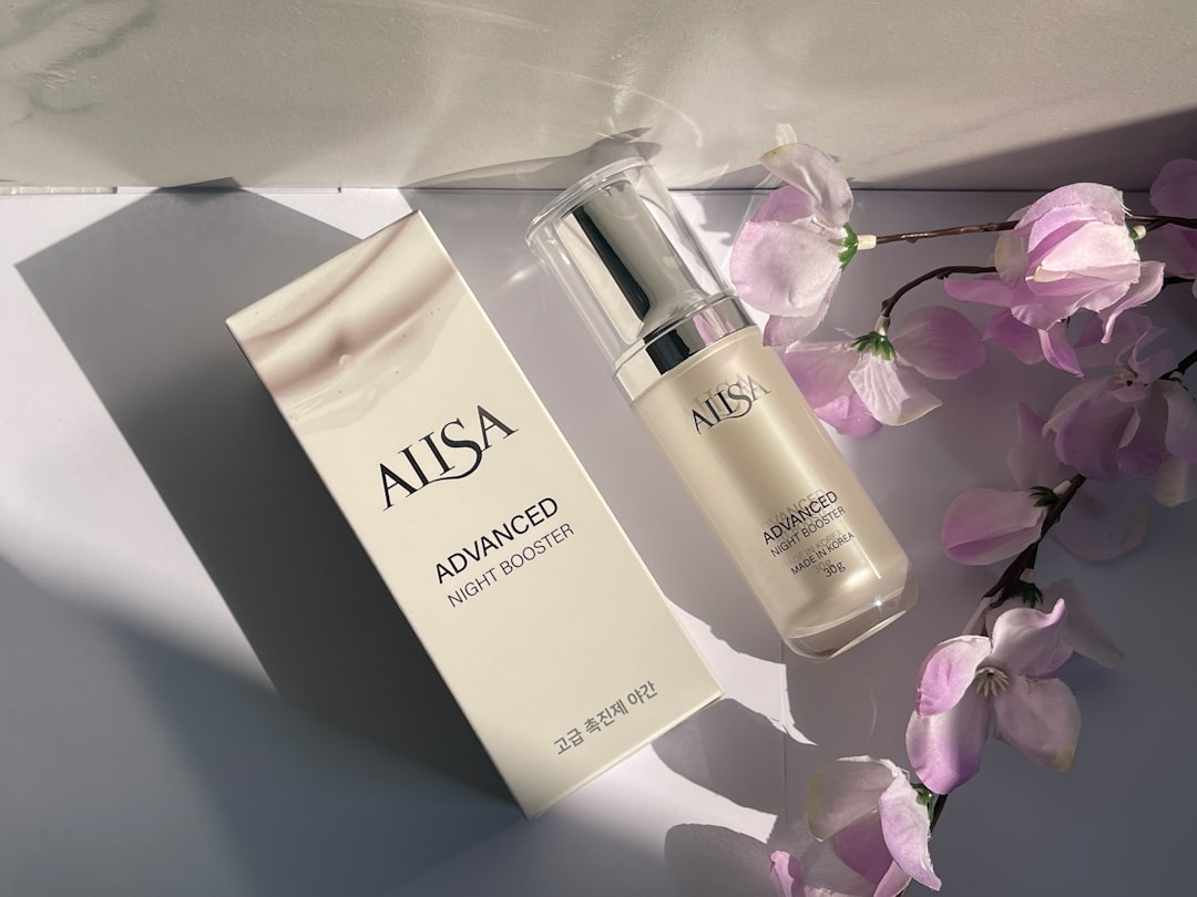 a bottle of skin care next to a box